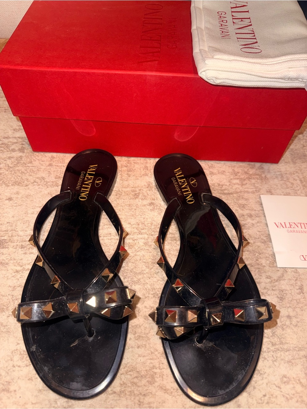 Valentino Garavani Black Rockstud Bow Jelly Sandals with Gold Studs